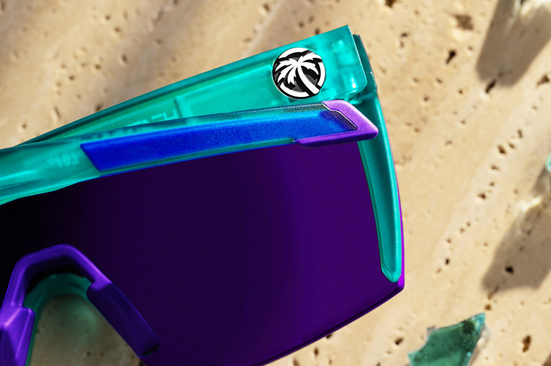 Close up of arm of Heat Wave Performance XL Lazer sunglasses with purple lenses and aqua frame