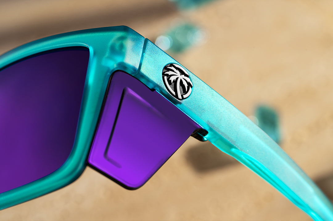 Close up of purple side shields of Heat Wave Performance XL Vise sunglasses with purple lenses and aqua frame