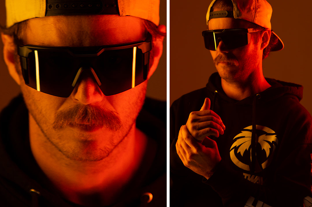 Handsom man wearing Heat Wave Visual Future Tech Sunglasses with black frame and black lens.