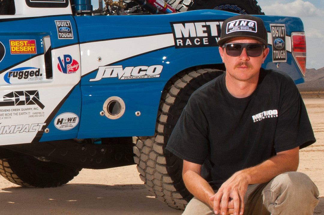 Race Truck driver Jason Voss wearing Heat Wave Visual Regulator Sunglasses with black frame and black lenses.