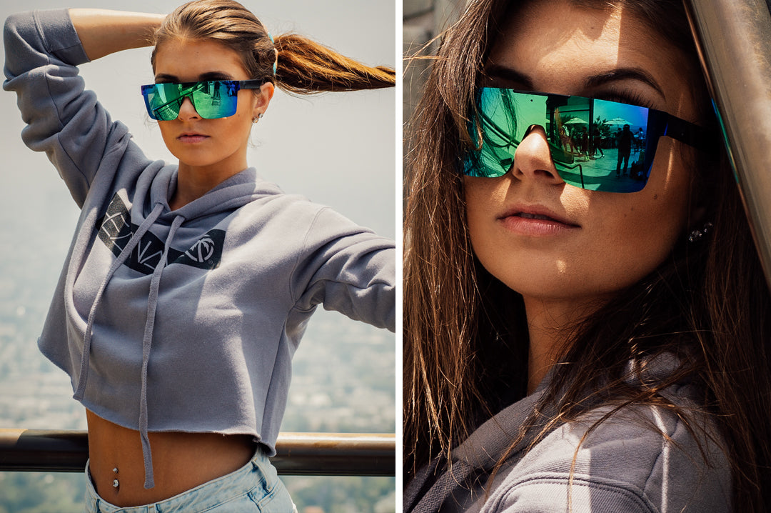 Women out in the city wearing Heat Wave Visual Quatro Sunglasses with black frame and piff green lens.