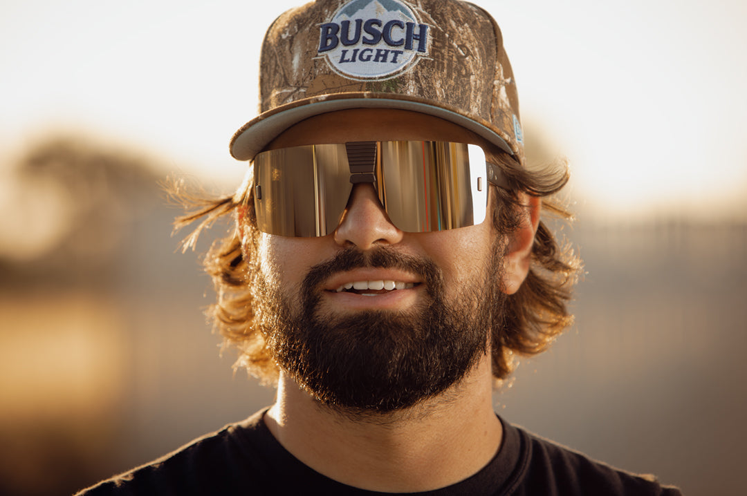 Esmarco wearing the Heat Wave Visual Vector Sunglasses with silver lens.