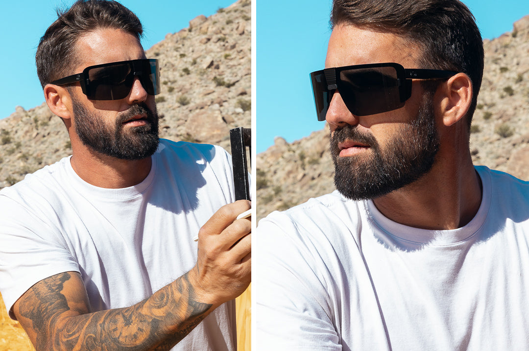 Young dude wearing the Heat Wave Visual Vector Sunglasses with black frame and anti-fog black lens. 