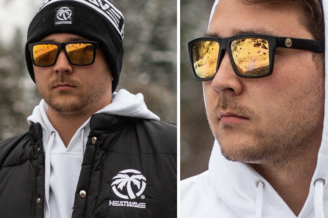 Young guy out in the snow wearing Heat Wave Visual Vise sunglasses with gold lenses.