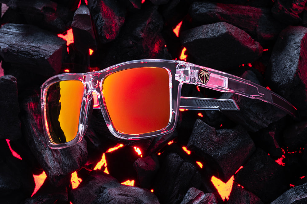 Side View of Heat Wave Performance Vise Vapor Clear Sunblast safety sunglasses with the side shields removed and hot bbq coals behind them.