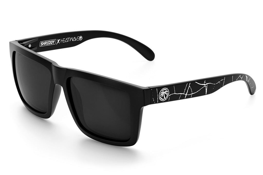 Heat Wave Visual XL Vise Sunglasses with black frame, shreddy crack print arms and black lenses.