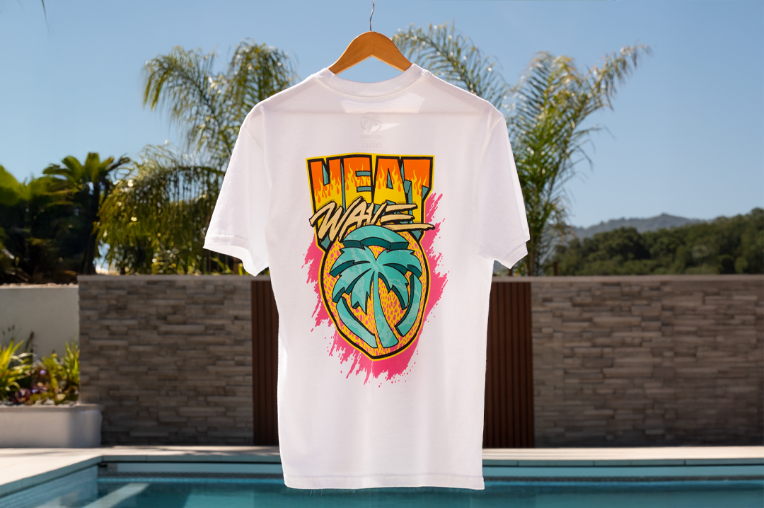 Heat Wave Visual Intense White T-shirt with a pool in the background.